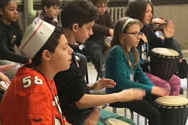 Kids playing hand drums