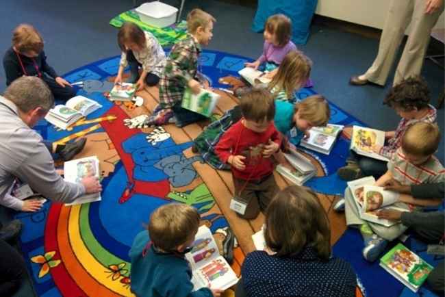 Kids reading books on the floor