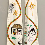 White liturgical stole with angel, stars, manger, shepherd, and animals