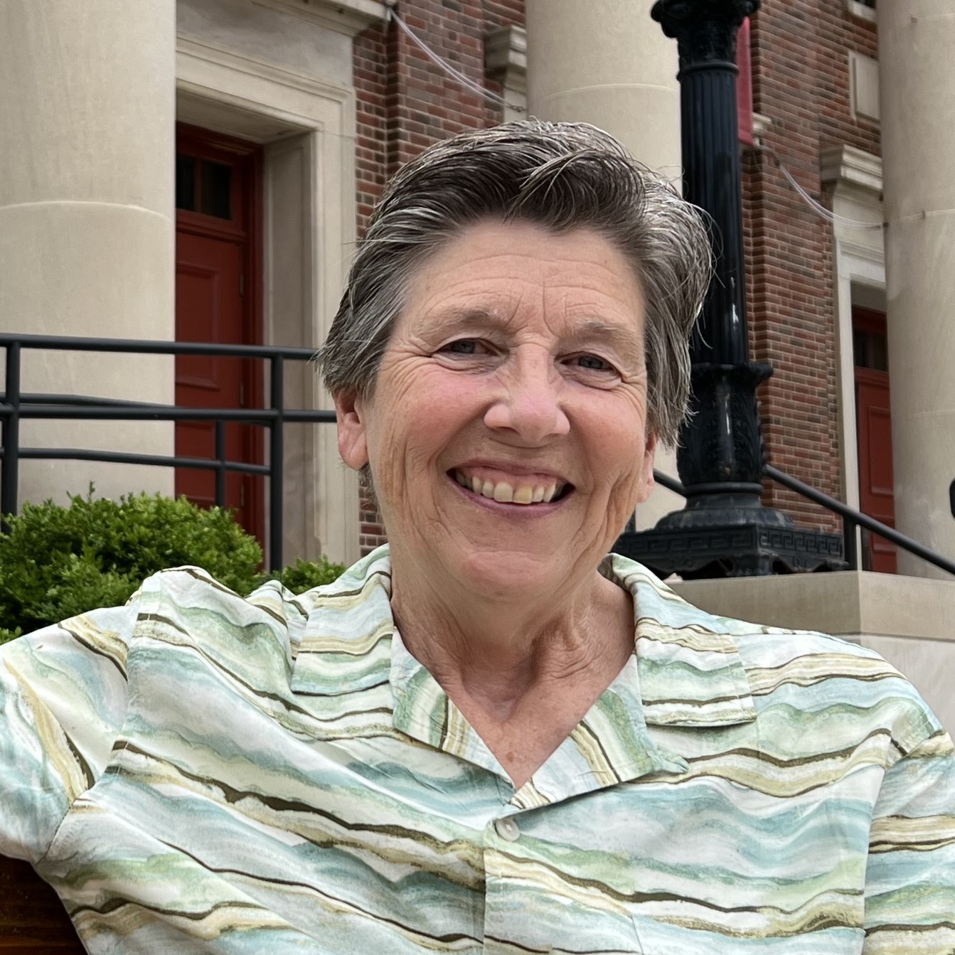 Senior Minister Eldonna Hazen in front of First Congregational UCC, Madison