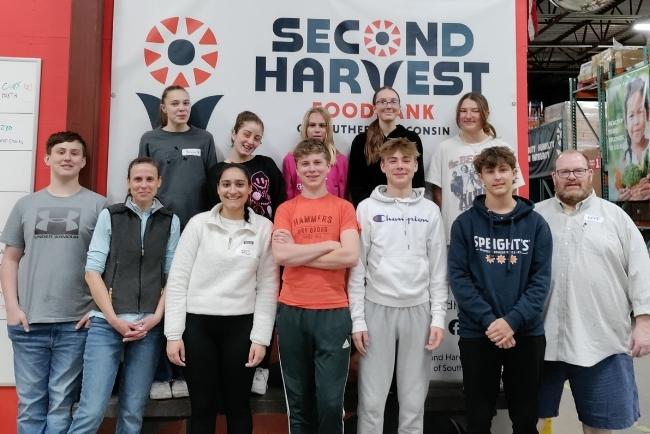 youth at a volunteer day at a food bank