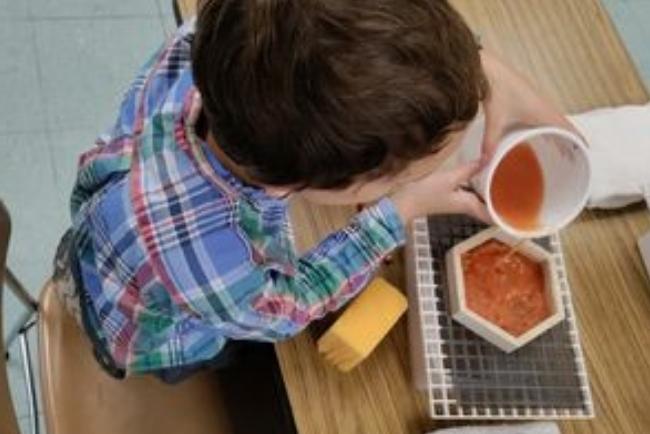 child making home-made paper