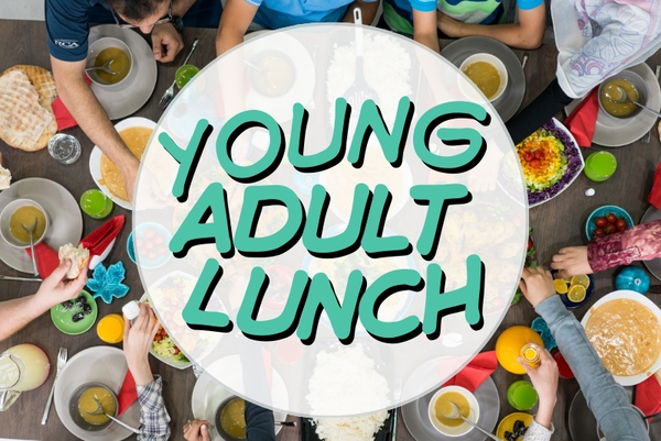 young people enjoying food and the company of each other around a table