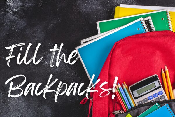 school backpack stuffed with folders and notebooks, along with pencils and a calculator