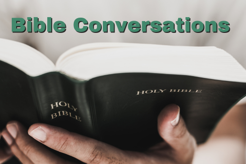 hands holding an open bible